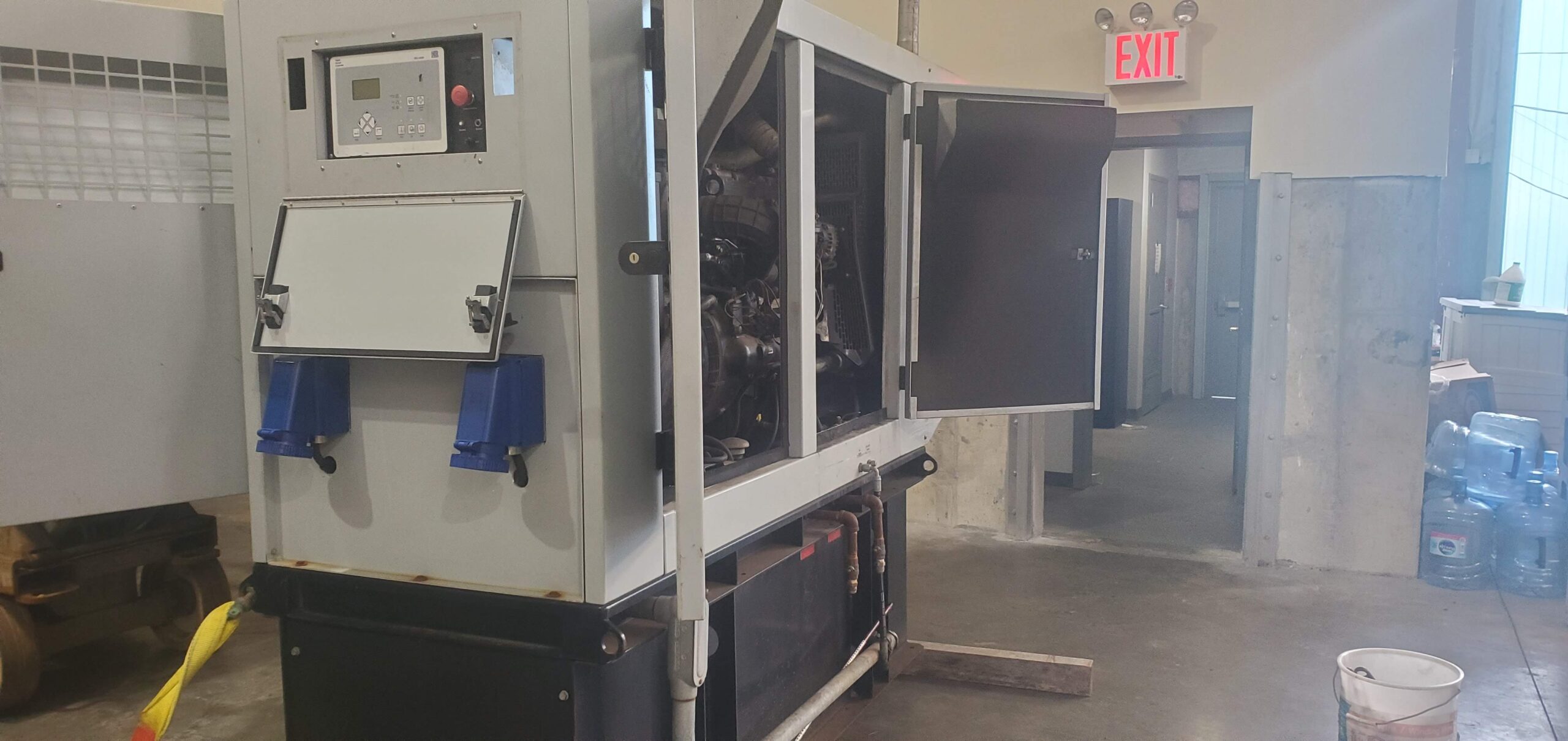 Rebuilt blue centrifugal pump on workbench at A2Z Pump Repair shop